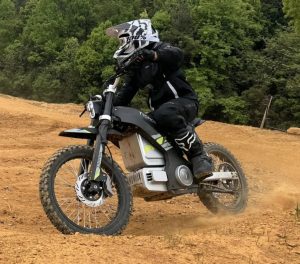 The Tromox MC10 Trail X speeding along an open trail, demonstrating its powerful off-road performance.